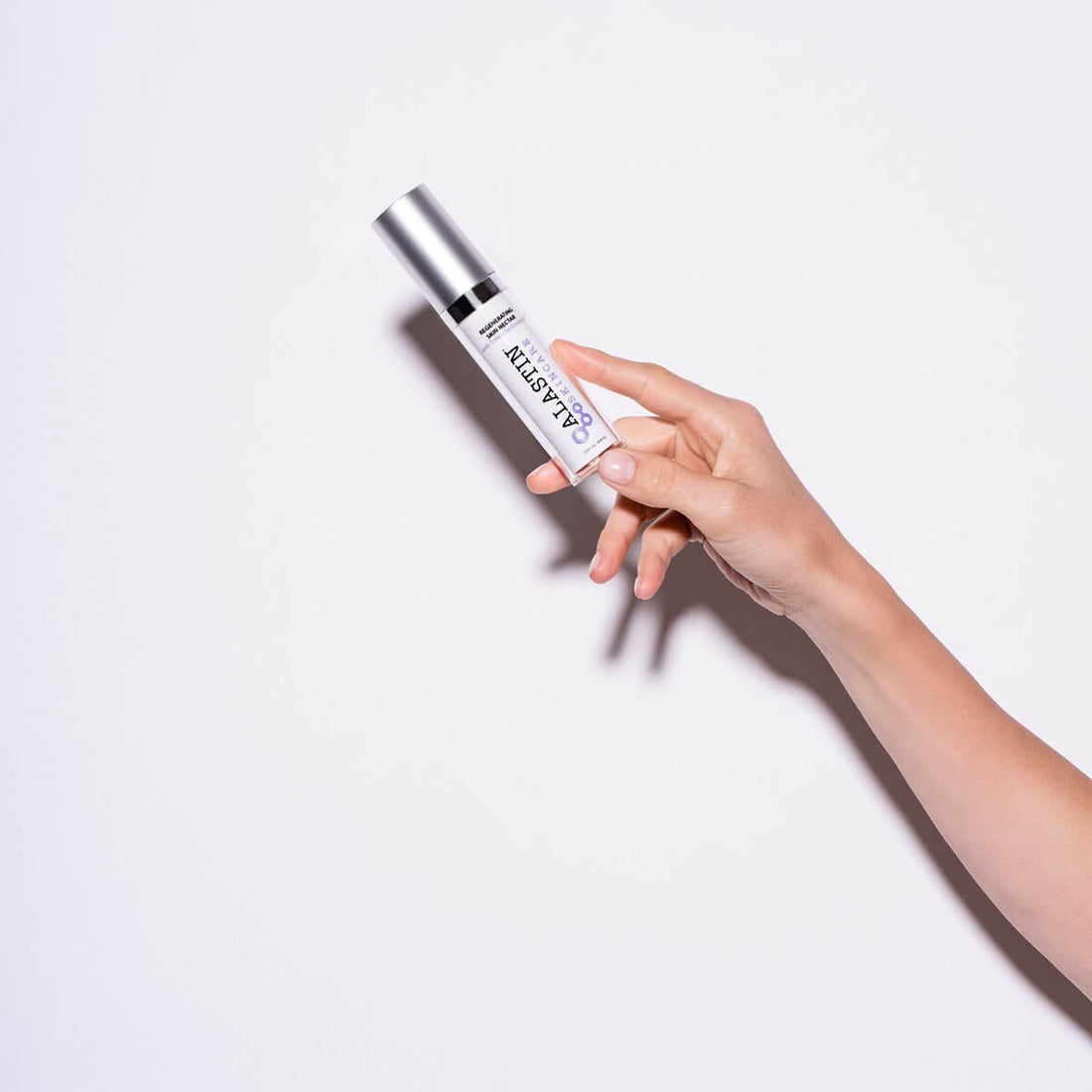 Woman Holding Liquid Post Surgery Serum