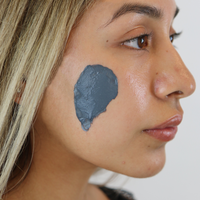 Woman With Detox Clay Mask On Her Cheek